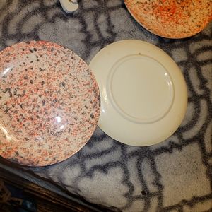 I have  8 of pink plates of pink an marbled an 6 I believe  of the gold splatter